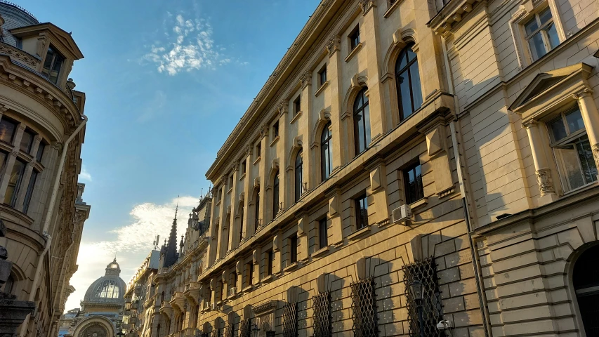 an old european city is bathed in golden sunlight