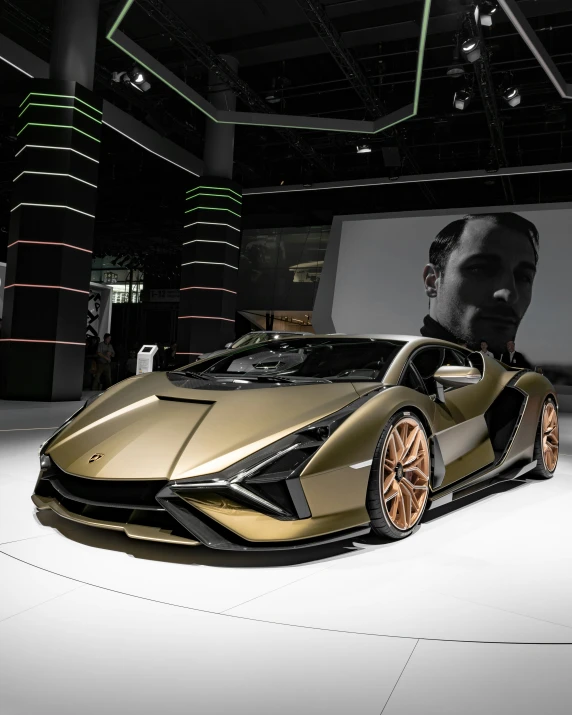 a man's head is shown behind a gold colored sports car