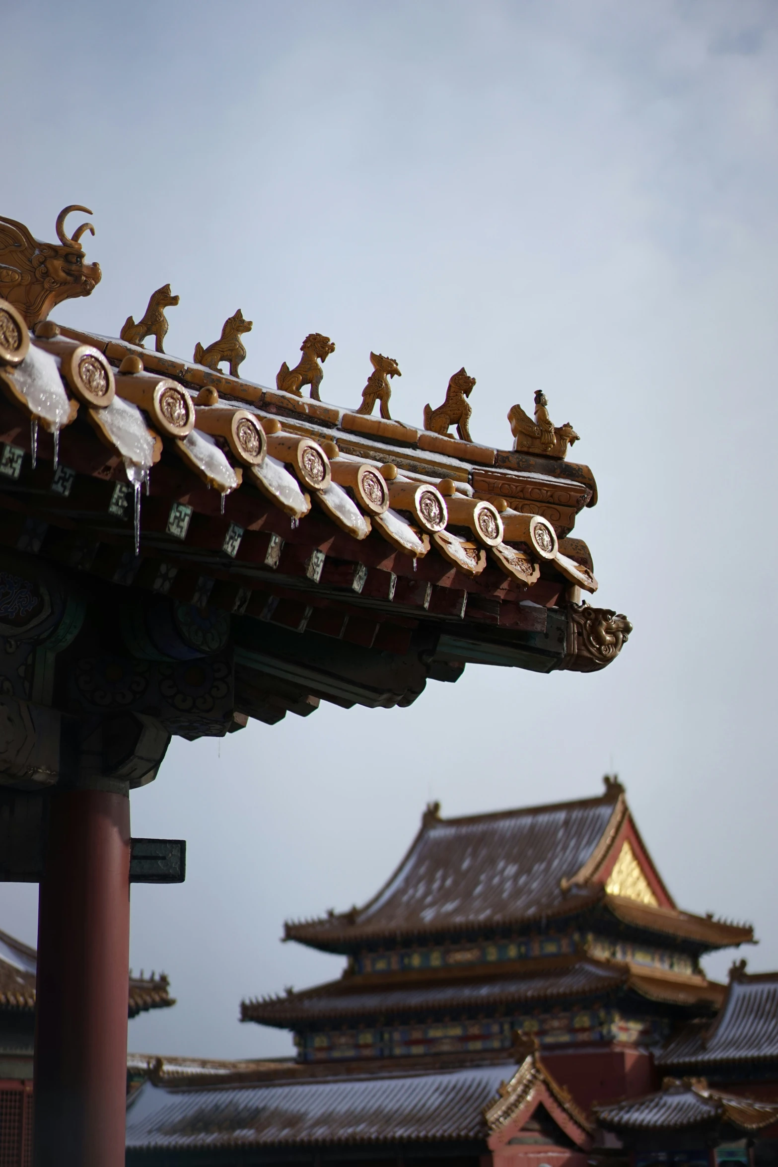 ornate roofing on the chinese building with statues