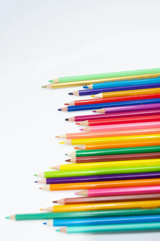 rainbow colored pencils are shown next to each other