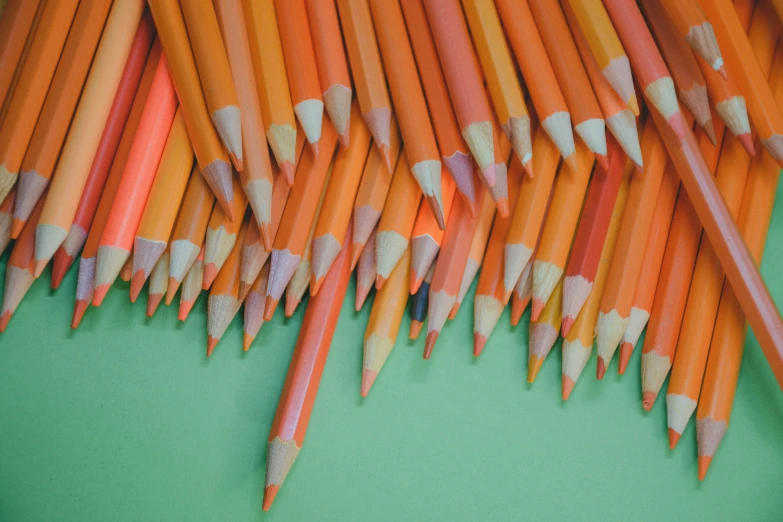 a stack of pencils sitting on top of a table