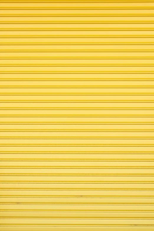 there is a yellow garage door with some lines painted on it