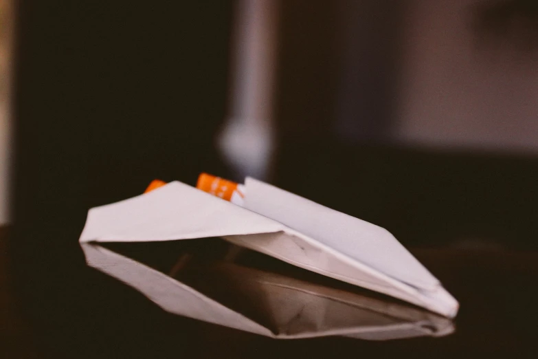 a folded paper box is sitting on a table