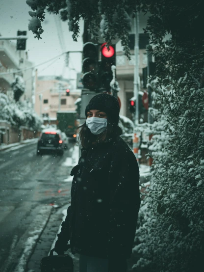 a person wearing a mask while standing in the street