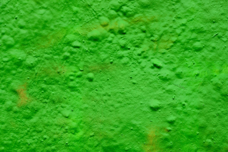 the green texture of a cement wall is abstract