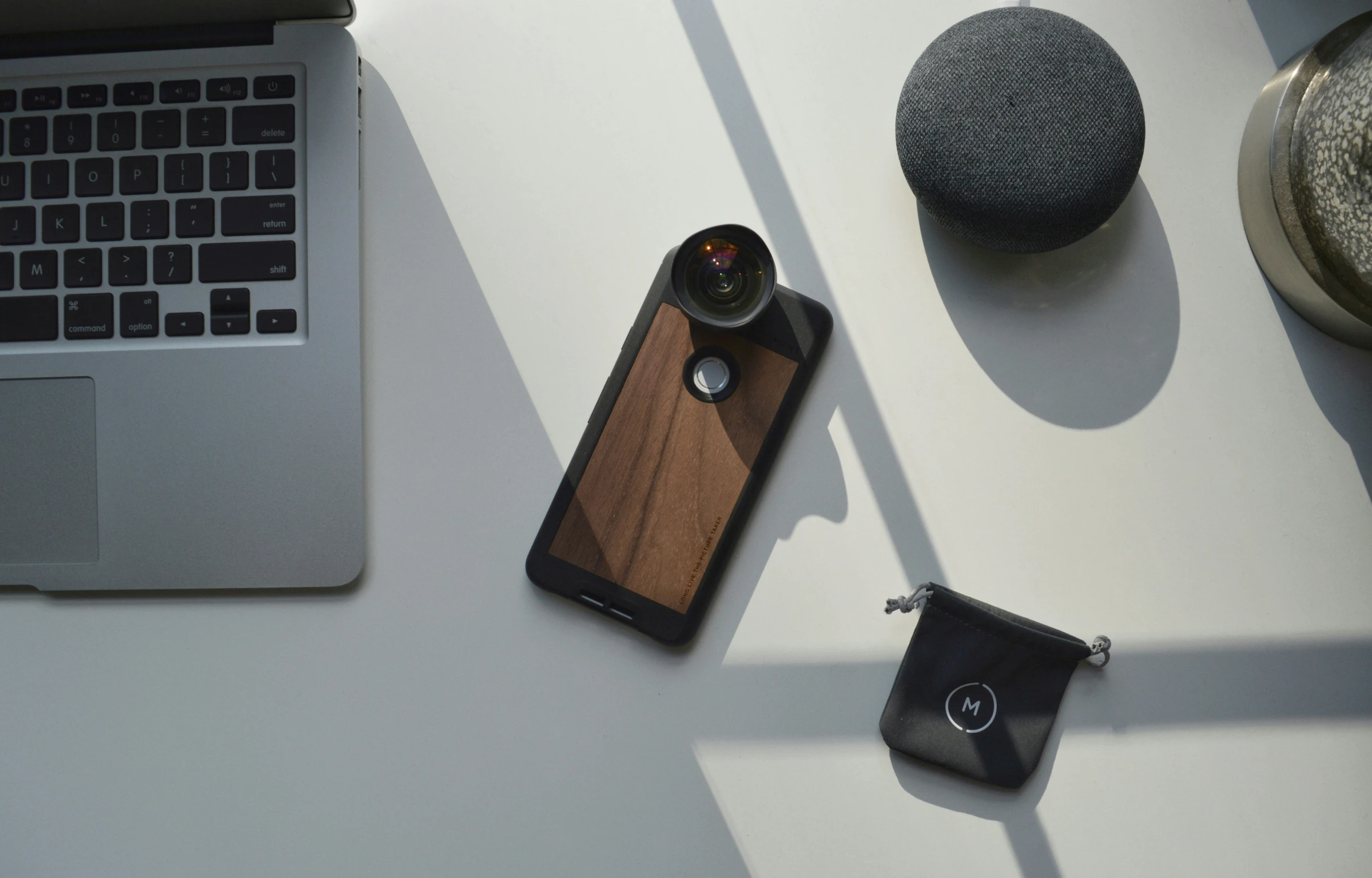 an open laptop and some other items on a table