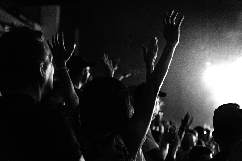 a crowd of people standing next to each other at a concert