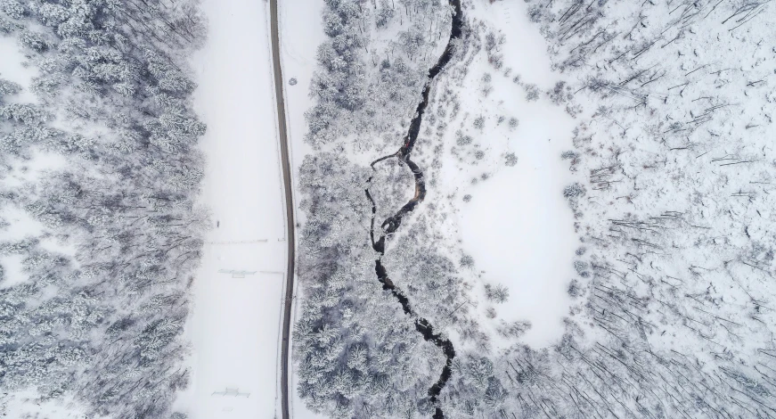 an aerial po looking down at a snowy, icy landscape