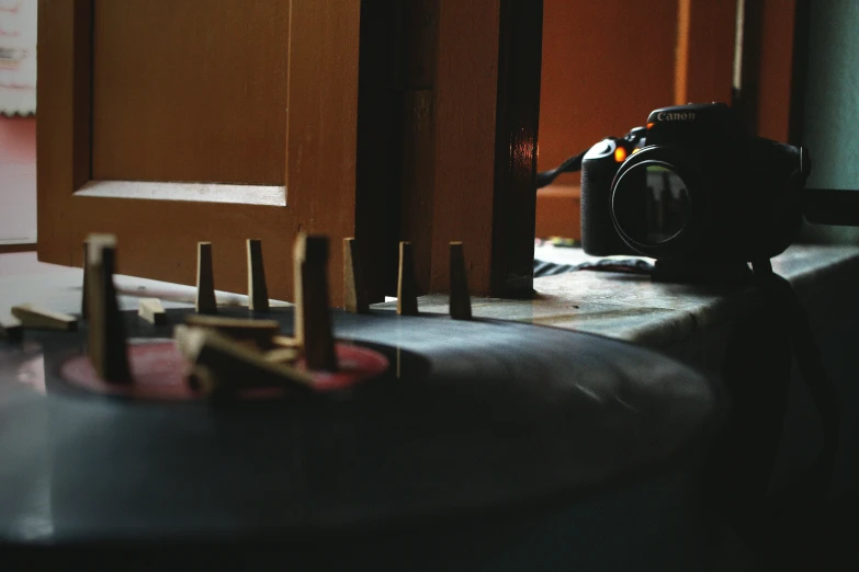 a camera is sitting on a table next to the wall