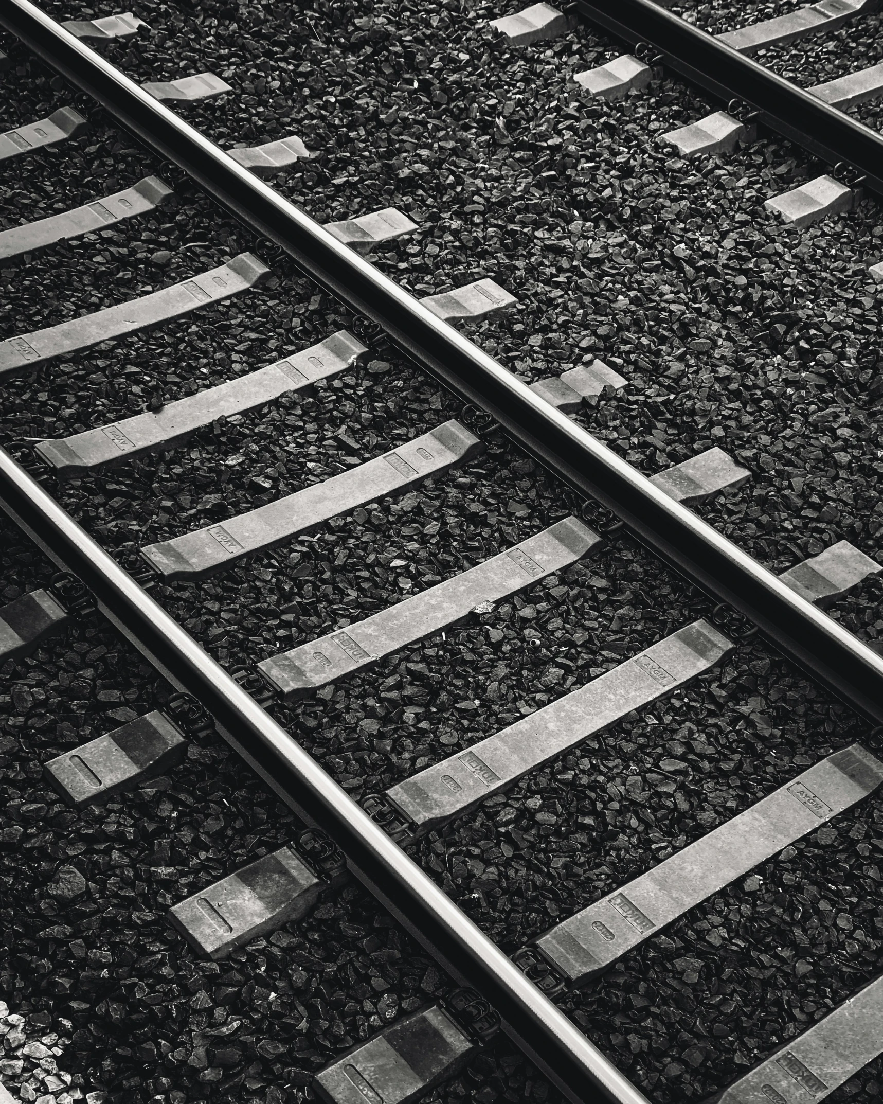 railroad tracks with white stripes in the middle