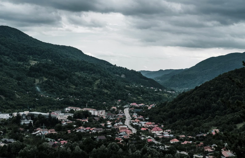 a bird's eye view of a town and mountains