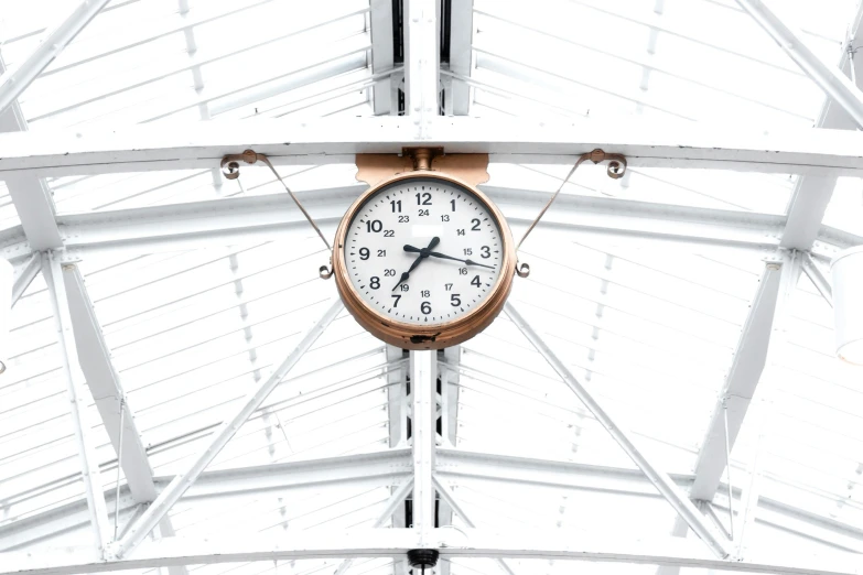 a clock sitting on the wall of a building