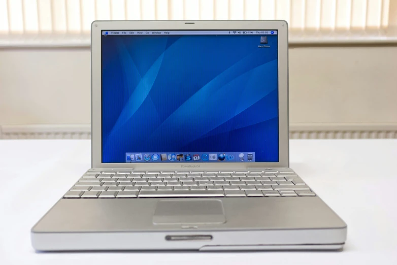 a laptop computer sitting on top of a desk