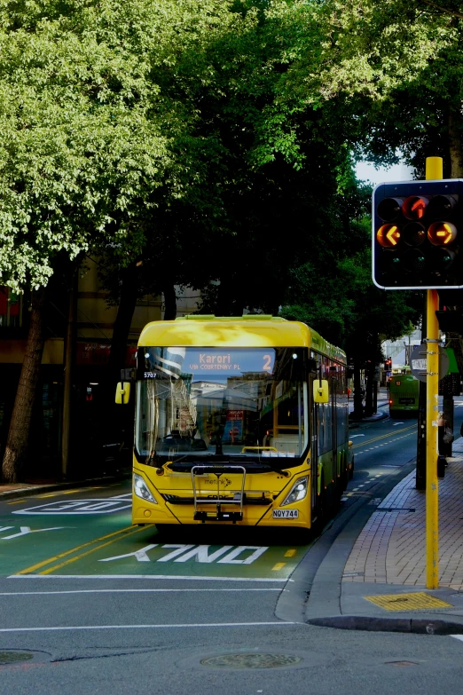 a yellow bus that is sitting on a street