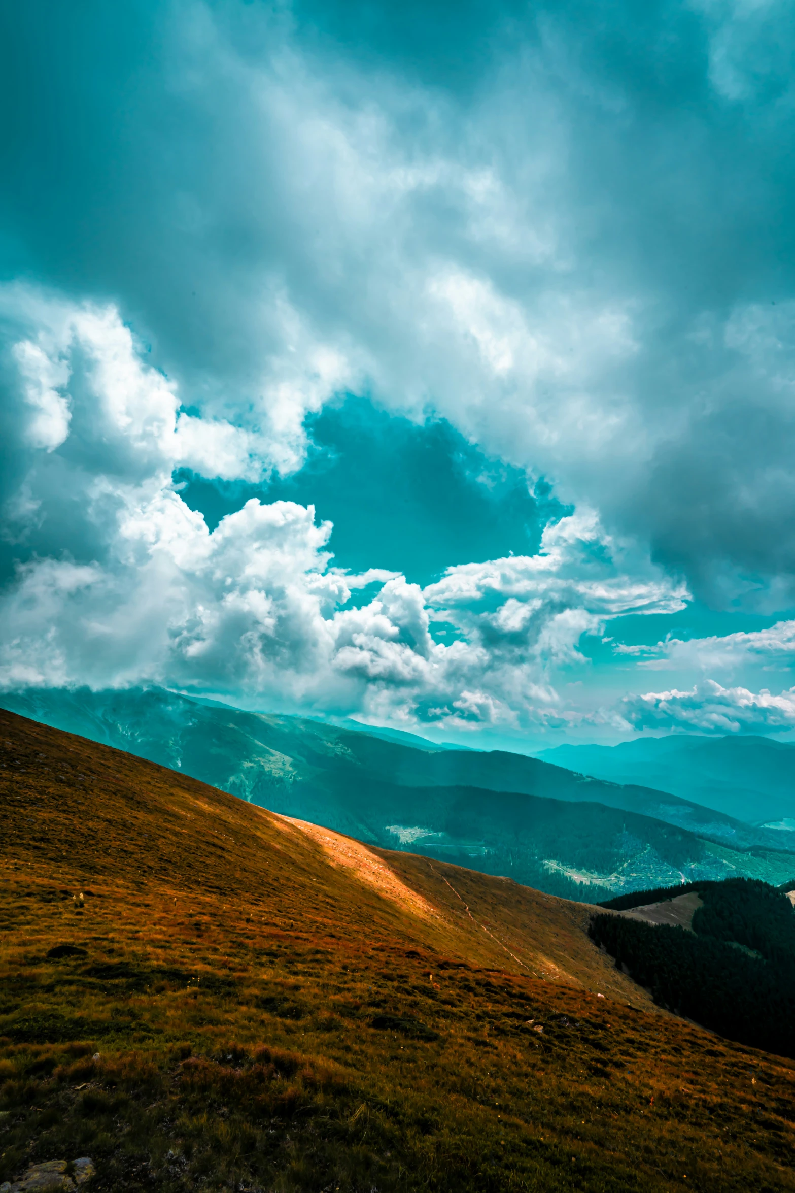 some clouds and mountains in the distance