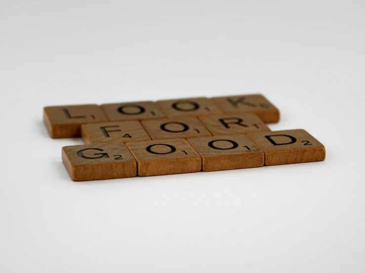 the two pieces of brown wood have the word look, for good