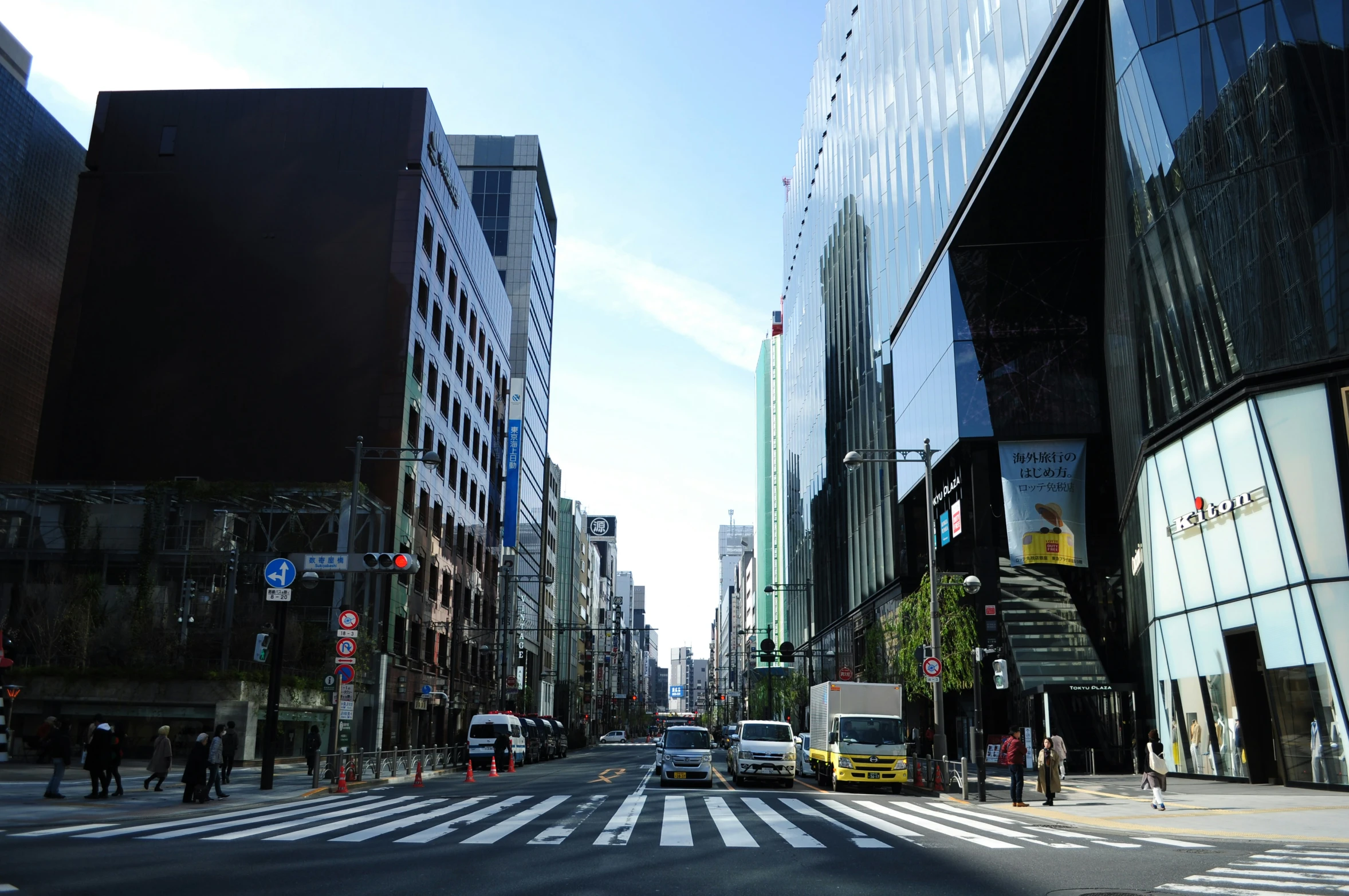 a crosswalk near several tall buildings on a street