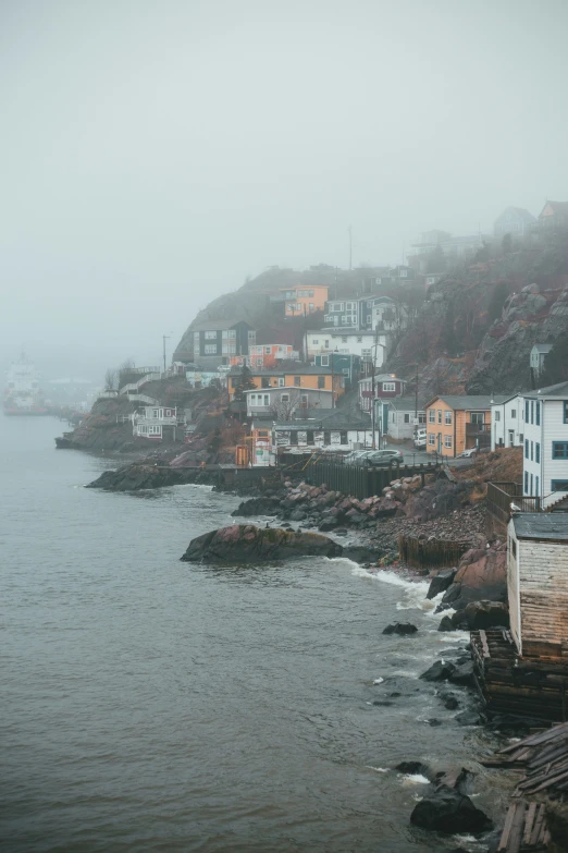 the small town is perched on the mountainside above the water