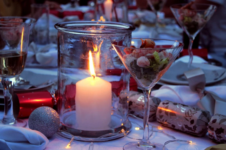 there is a candle and glasses at this wedding