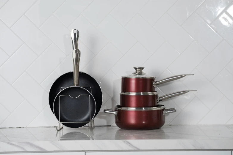 a metal pan and other pots are on a stove