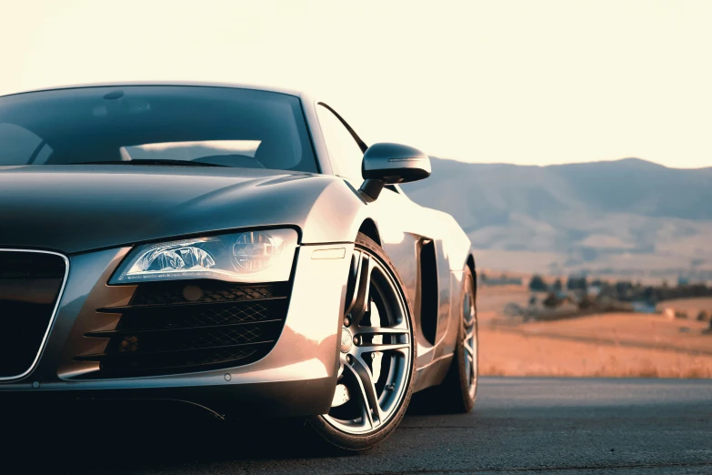 a car is parked on the road in a mountainous area