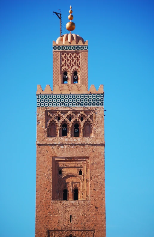 an image of a large tower with blue sky in the background