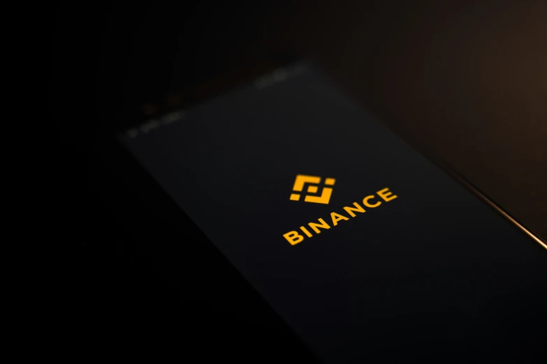 an image of binance logo on a phone