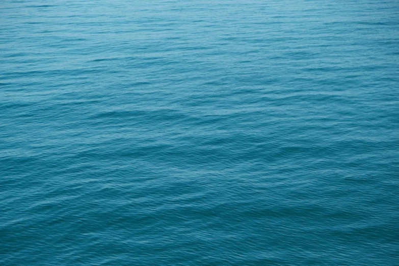 a boat floating on top of a large body of water