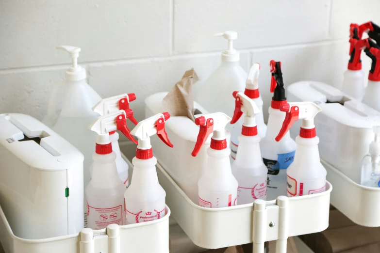 several containers holding many white containers for bottles