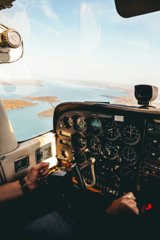 a man in a plane cockpit with the flight deck open