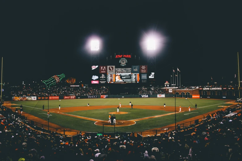 there are many baseball players in the field at night