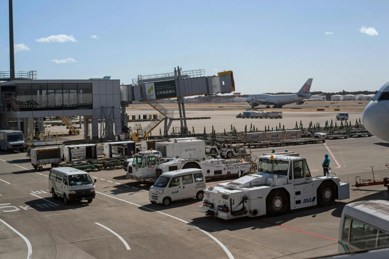 a large white truck sitting next to an airport