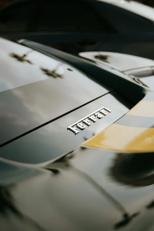 the hood of a car that has stripes and a sign