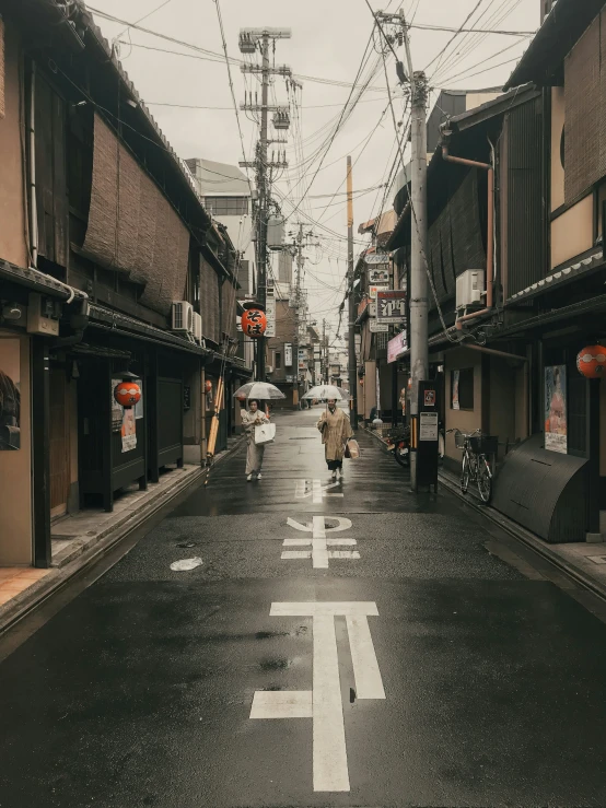 a city street in the rain with an out door sign