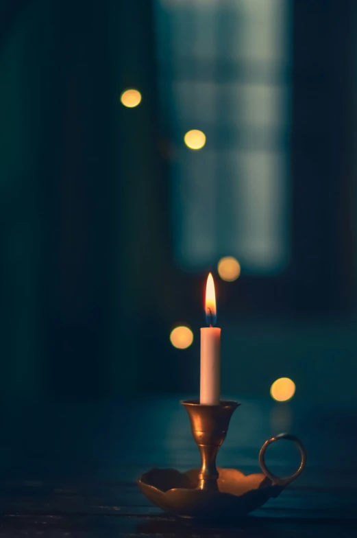 a candle that is sitting in the middle of a table