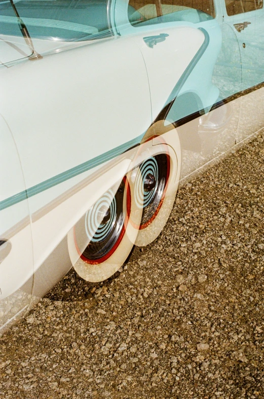 two identical hats are placed under the back of a vehicle