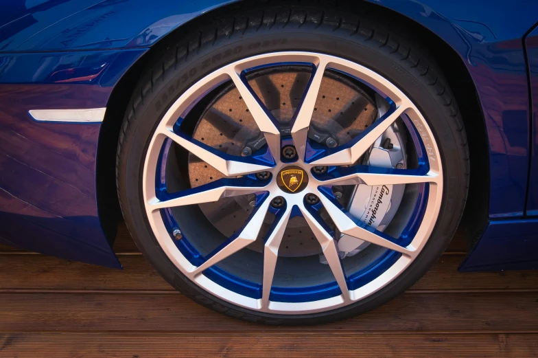 a close up of a wheel and tires on a sports car