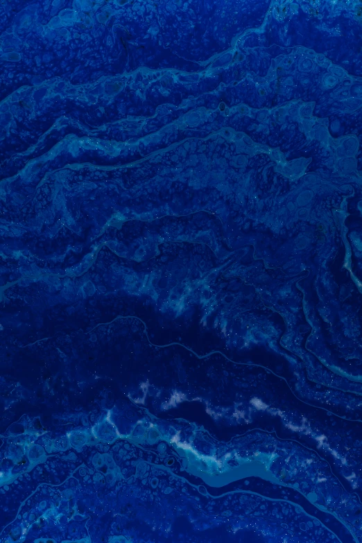 the blue and black textured paint looks like a painting
