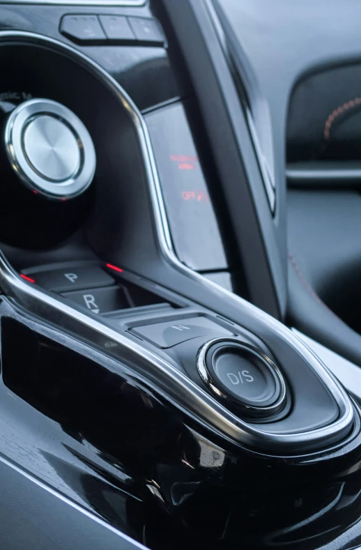 a gear shift inside a car next to a window