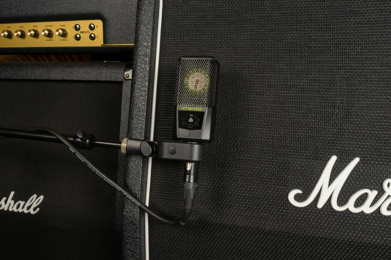 a cell phone is on top of an amp