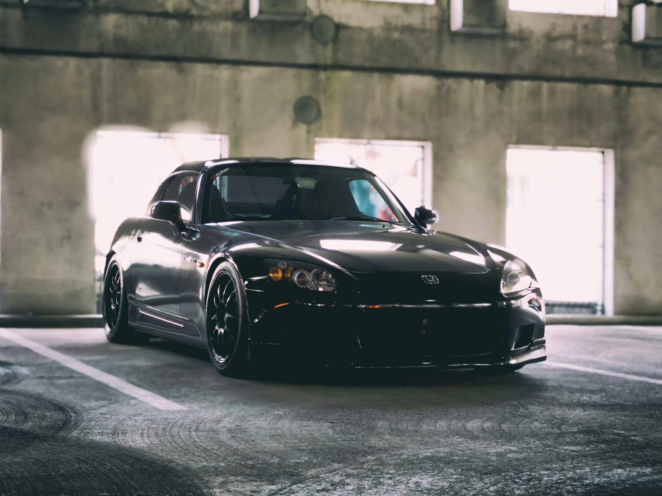 the front end of a small, shiny sports car