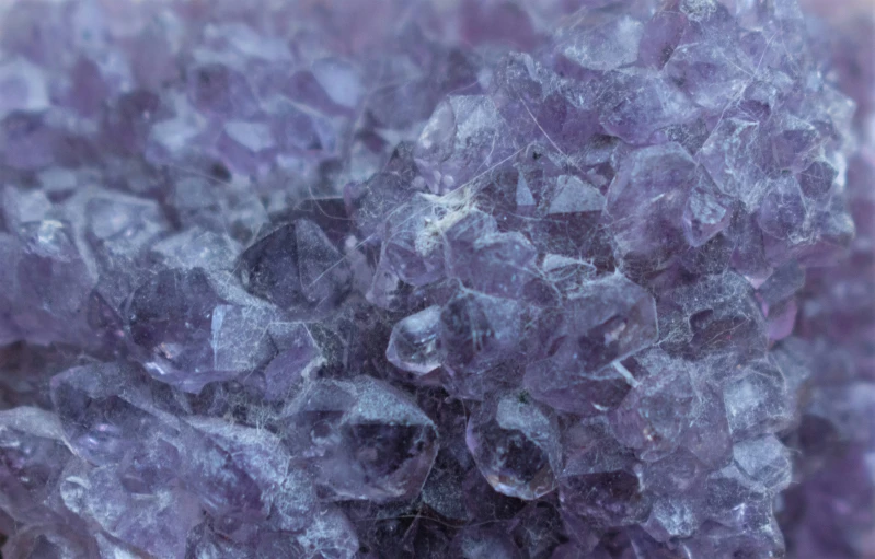 a close up image of a large cluster of purple crystals