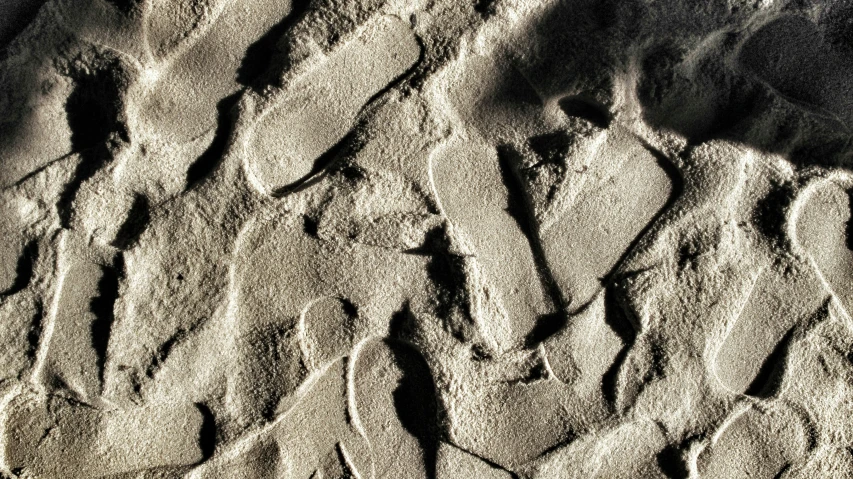 a black and white image of a rock wall