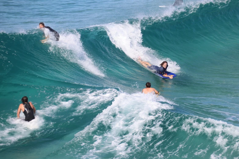 people are surfing in the waves in the ocean