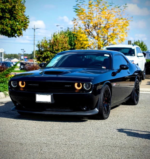 a black car parked in a parking lot