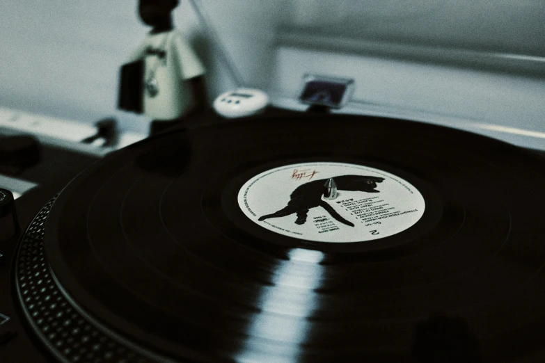 a record player is playing on an analog record