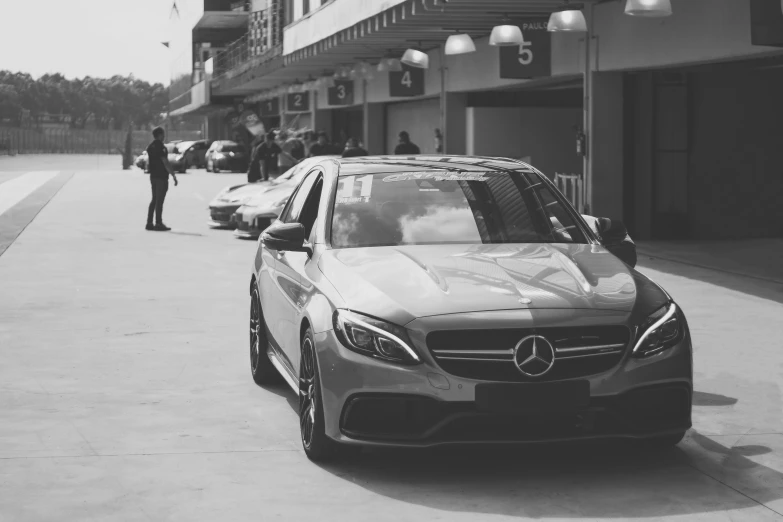 a couple of cars parked next to each other on a street