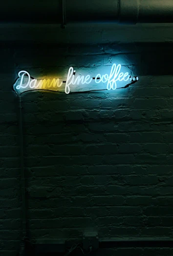 neon sign displayed on wall at night time