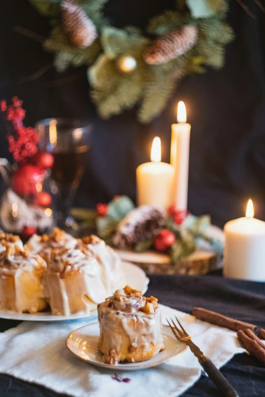 a table topped with cakes and candles
