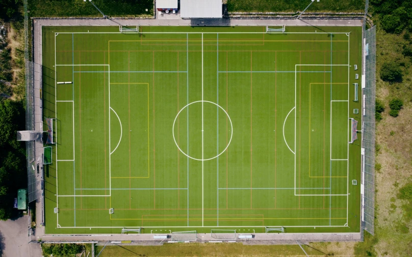 an aerial s of a soccer field with yellow markings